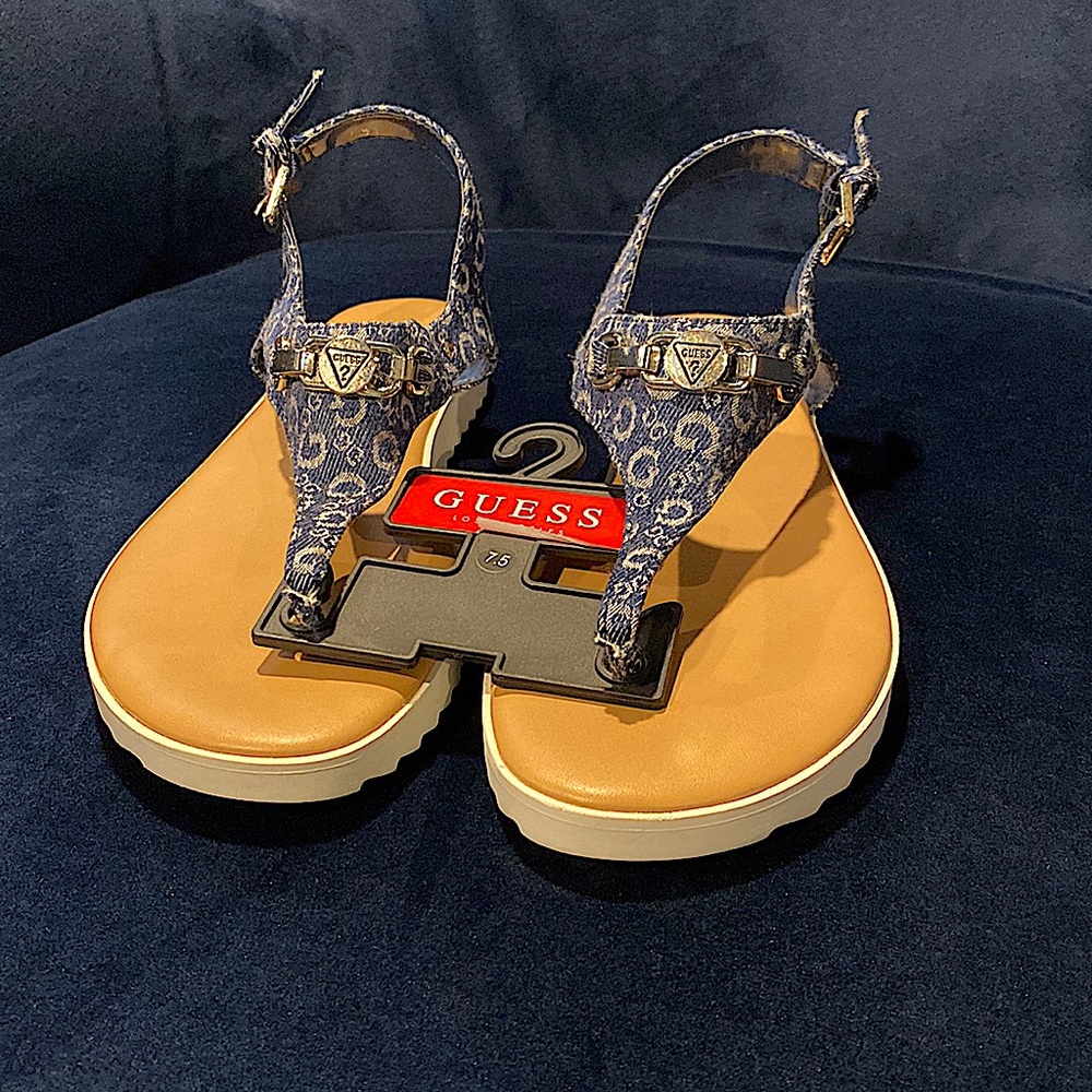 Dark blue fabric guess sandals , in the size 7.5 . Never worn before
